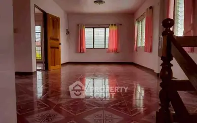 Spacious empty living room with tiled floor and large windows, perfect for customization.