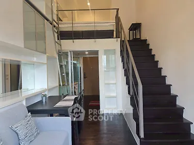 Modern loft apartment with mezzanine bedroom and stylish staircase