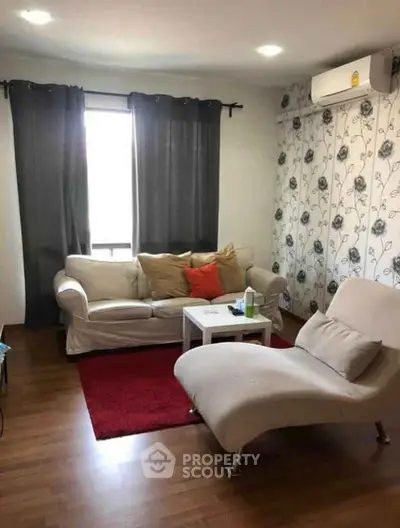 Cozy living room with modern furniture and floral wallpaper