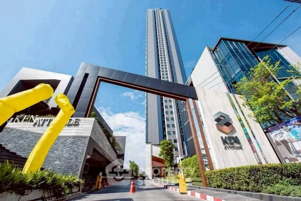 Stunning modern high-rise building with sleek entrance and vibrant surroundings.