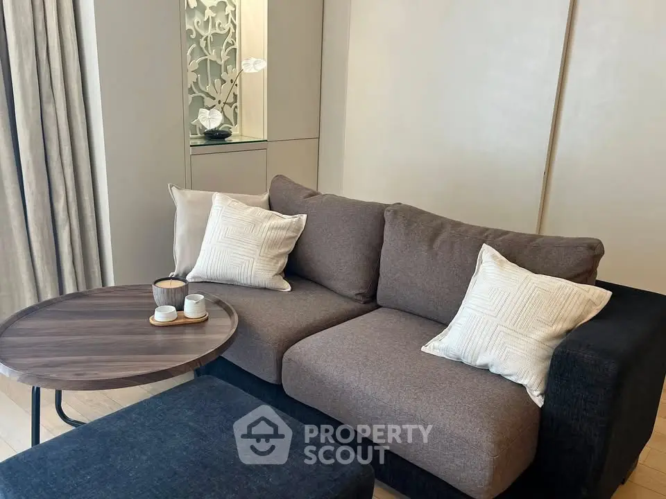 Cozy modern living room with stylish sofa and coffee table, perfect for relaxation.