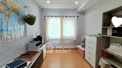 Charming study room with ample storage and natural light, perfect for productivity and organization.