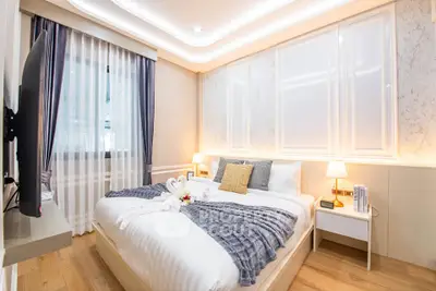 Luxurious bedroom with elegant decor and ambient lighting