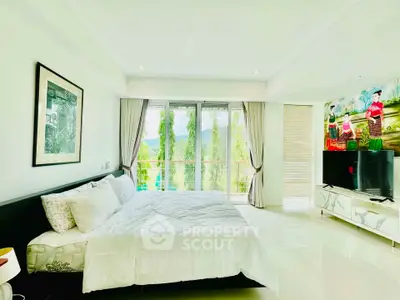 Spacious bedroom with large windows offering stunning views and elegant decor.