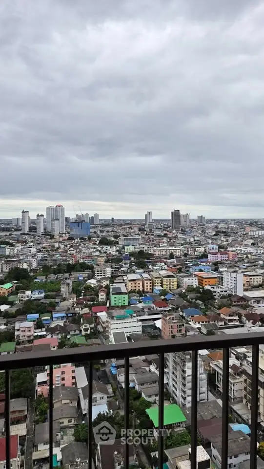 Stunning cityscape view from high-rise balcony showcasing urban skyline and vibrant neighborhood.