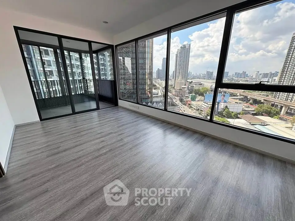 Spacious corner unit with floor-to-ceiling windows offering stunning city views in a modern high-rise building.