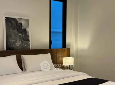 Modern bedroom with stylish decor and cozy lighting