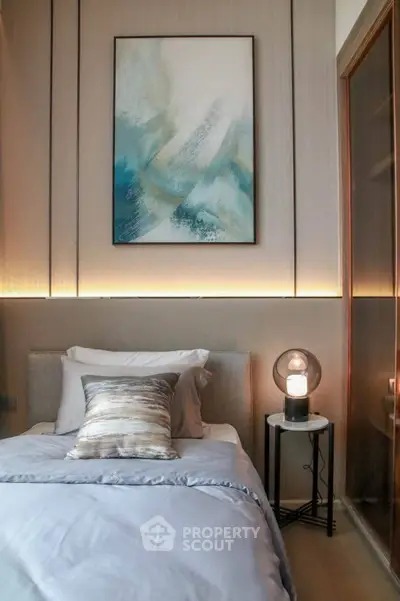 Cozy modern bedroom with stylish decor and ambient lighting