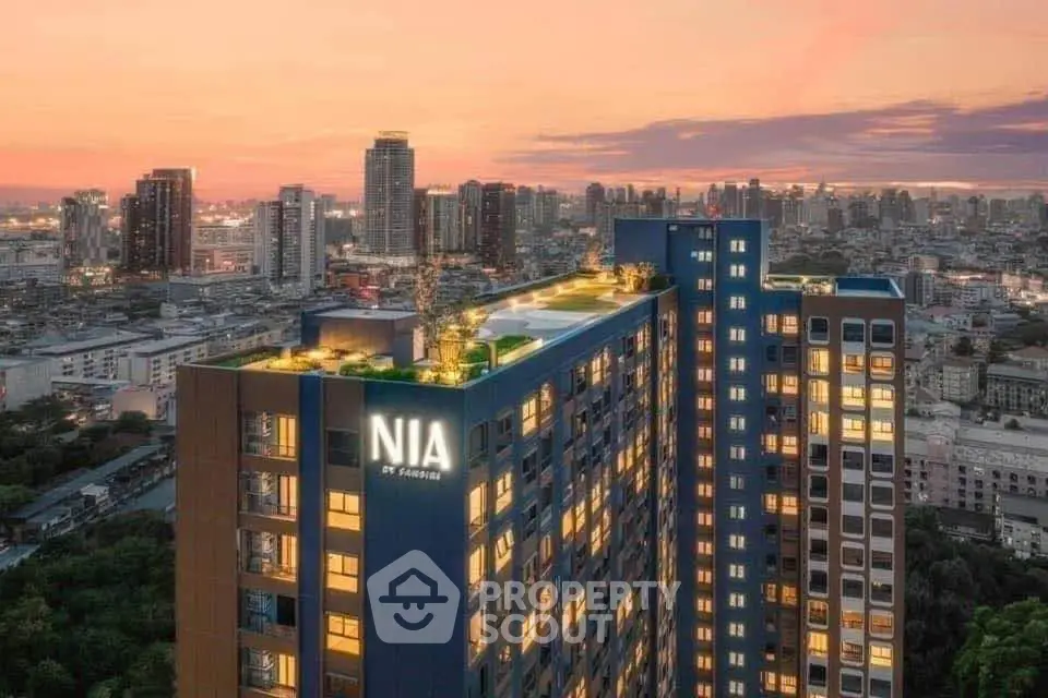 Stunning cityscape view of modern high-rise building at sunset with rooftop garden.