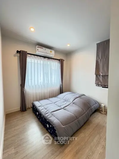 Cozy bedroom with modern decor and natural light
