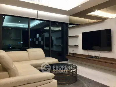 Luxurious modern living room with sleek design and large windows offering stunning views.
