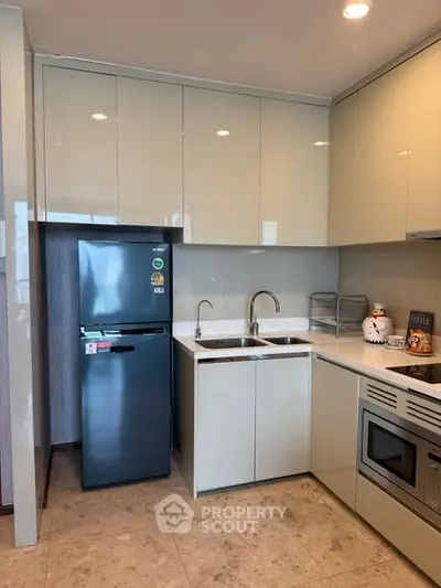 Modern kitchen with sleek cabinetry and stainless steel appliances