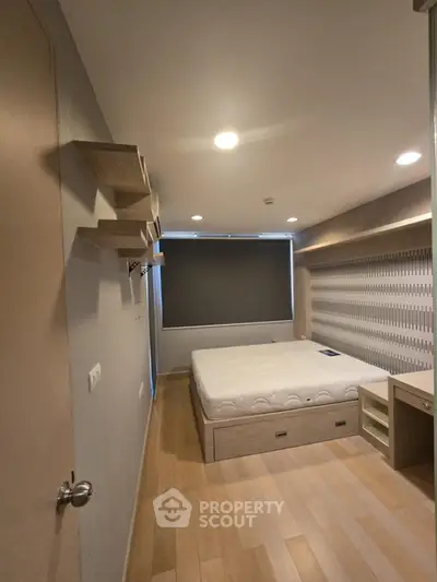 Modern bedroom with sleek design and built-in storage solutions