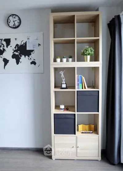 Modern living room with stylish shelving unit and world map decor