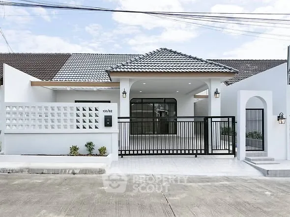 Charming modern house with stylish facade and gated entrance