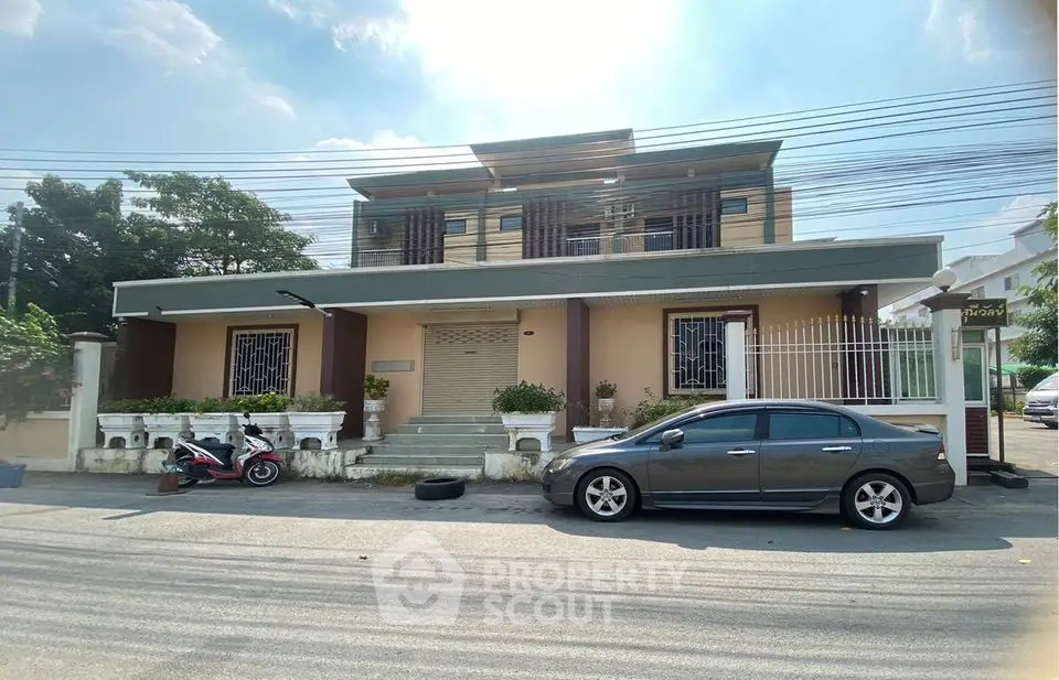 Spacious two-story house with modern facade and ample parking space