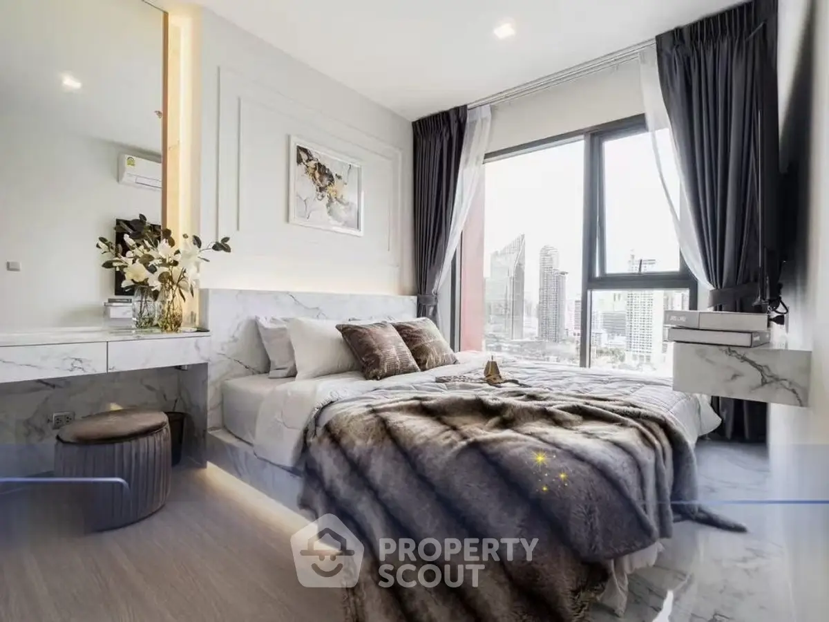 Luxurious bedroom with stunning city view, modern decor, and elegant furnishings in a high-rise apartment.