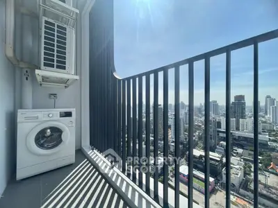 Stunning high-rise balcony with cityscape view and washing machine