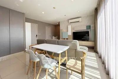 Modern living room with sleek furniture and large windows for natural light