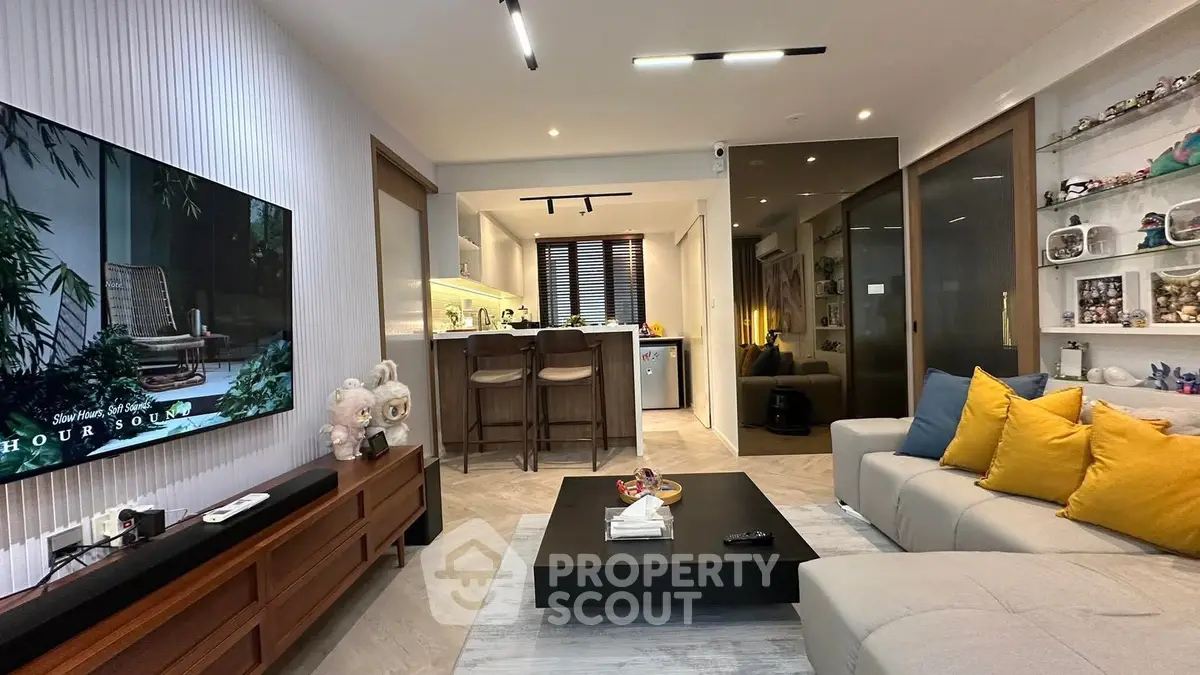 Modern living room with stylish decor and open kitchen layout
