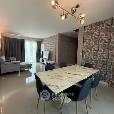 Spacious modern living room with elegant dining area and stylish decor