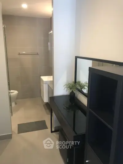 Modern bathroom with sleek design and elegant fixtures in a contemporary apartment.