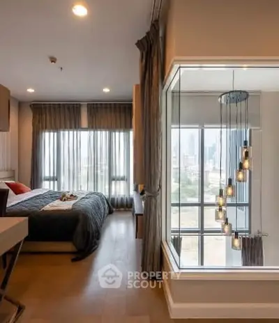 Luxurious bedroom with floor-to-ceiling windows and modern chandelier, offering stunning city views.