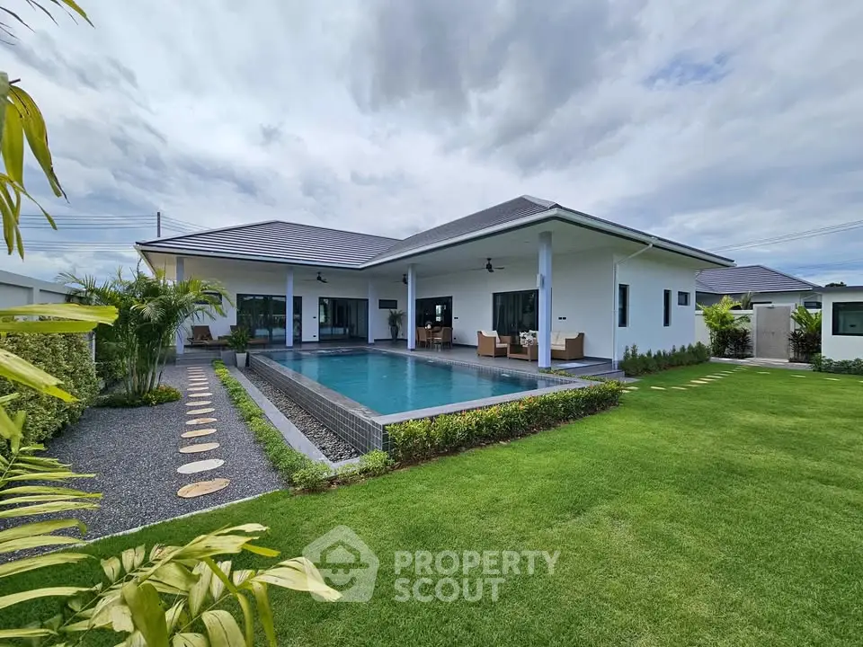 Luxurious modern villa with private pool and lush garden, perfect for serene living.