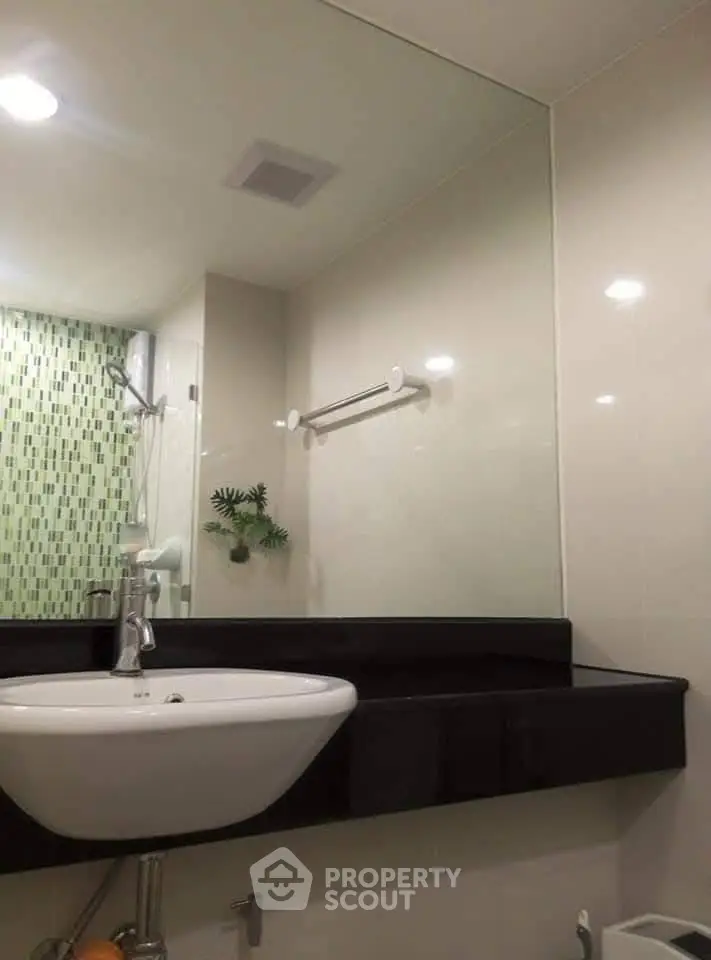 Modern bathroom with sleek sink and stylish tile accents