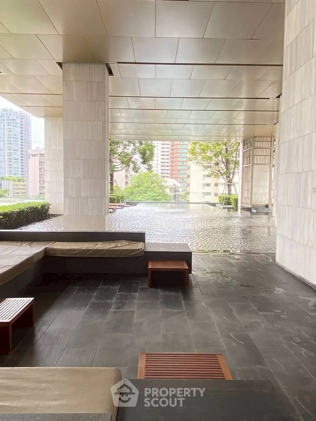 Luxurious modern building entrance with sleek design and city view