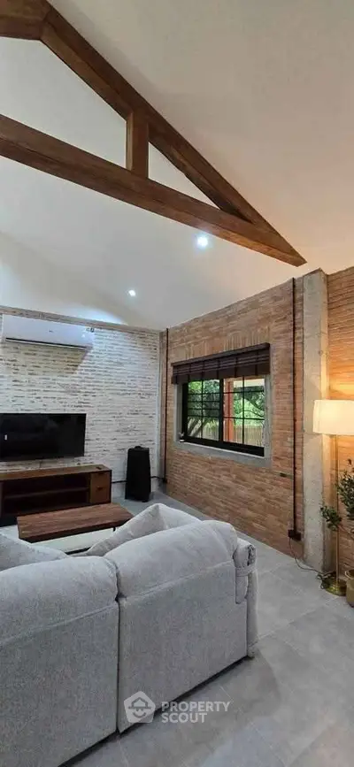 Spacious living room with high ceilings and modern decor