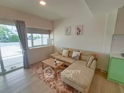 Modern living room with cozy beige sectional sofa and stylish decor