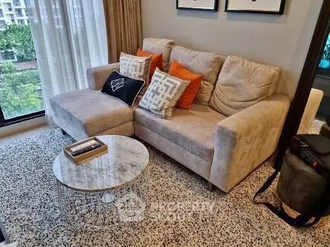Cozy living room with plush sofa and modern decor, perfect for relaxation and comfort.