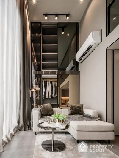 Chic modern living space with high ceilings, elegant furniture, and a sleek staircase leading to a stylish loft wardrobe area, perfect for urban living.