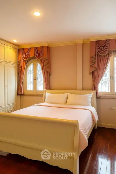 Elegant bedroom with classic decor and warm lighting