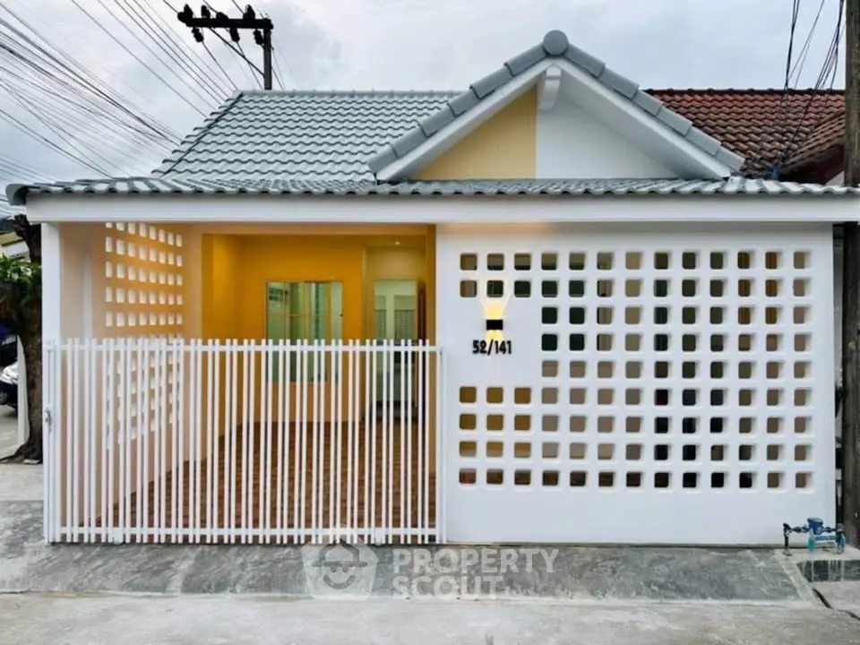 Charming single-story home with unique lattice facade and modern design.