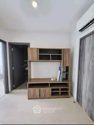 Modern interior with wooden storage unit and sleek design