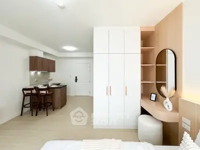 Modern studio apartment with stylish kitchen and cozy living area