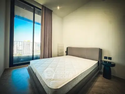 Modern bedroom with large window and city view, featuring a minimalist design and cozy atmosphere.