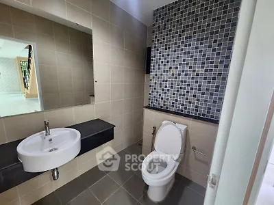 Modern bathroom with stylish tile design and sleek fixtures