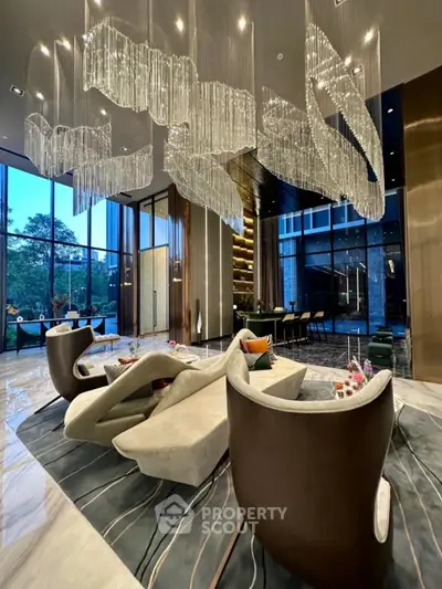 Luxurious modern living room with stunning chandelier and elegant furniture