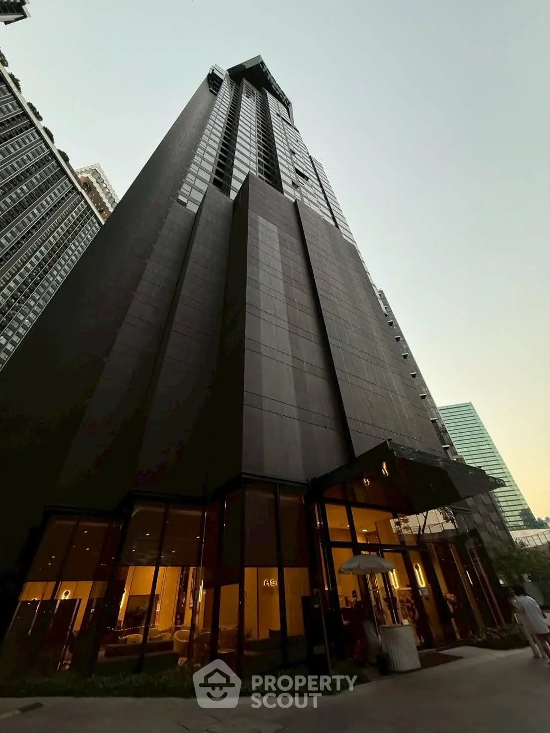 Stunning modern skyscraper with sleek design and glass facade in urban setting.