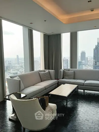 Luxurious living room with panoramic city views and elegant furnishings.