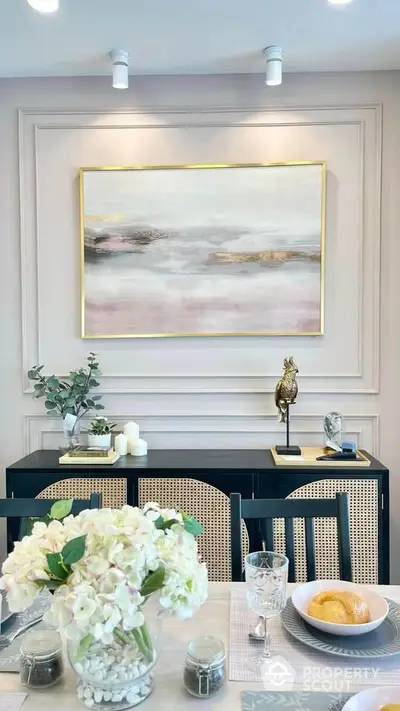 Elegant dining room with modern art and stylish decor