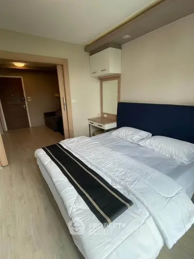 Modern bedroom with stylish decor and cozy ambiance in a contemporary apartment.