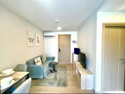 Modern living room with stylish decor and cozy seating area in a contemporary apartment.