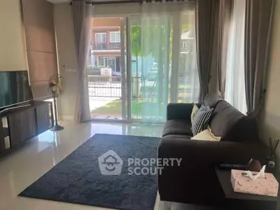 Modern living room with large windows and stylish decor