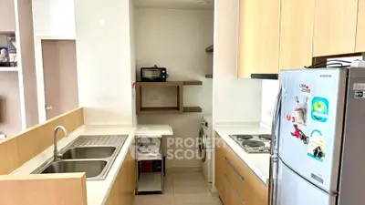 Modern kitchen with sleek appliances and ample storage space