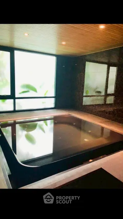 Luxurious indoor pool with modern design and ambient lighting