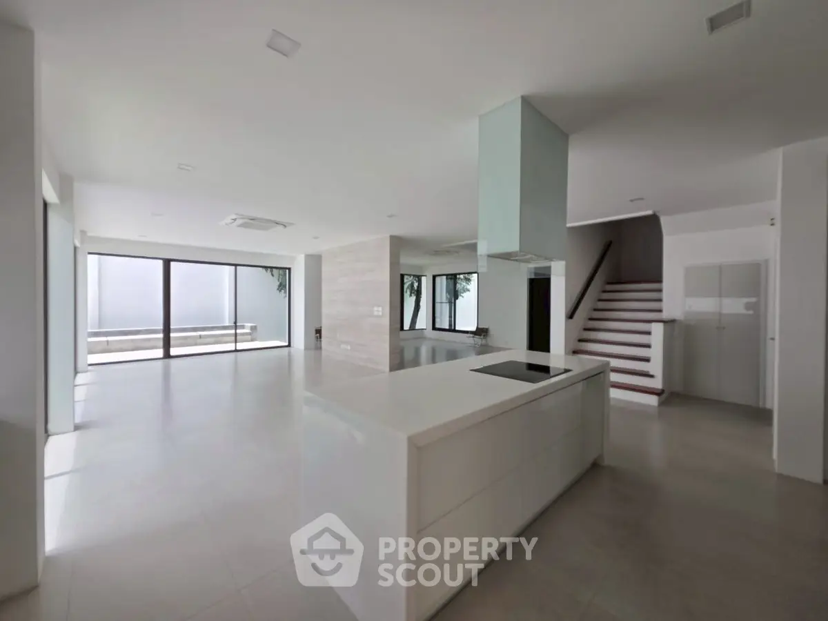 Spacious modern kitchen with open layout and sleek design in luxury home.
